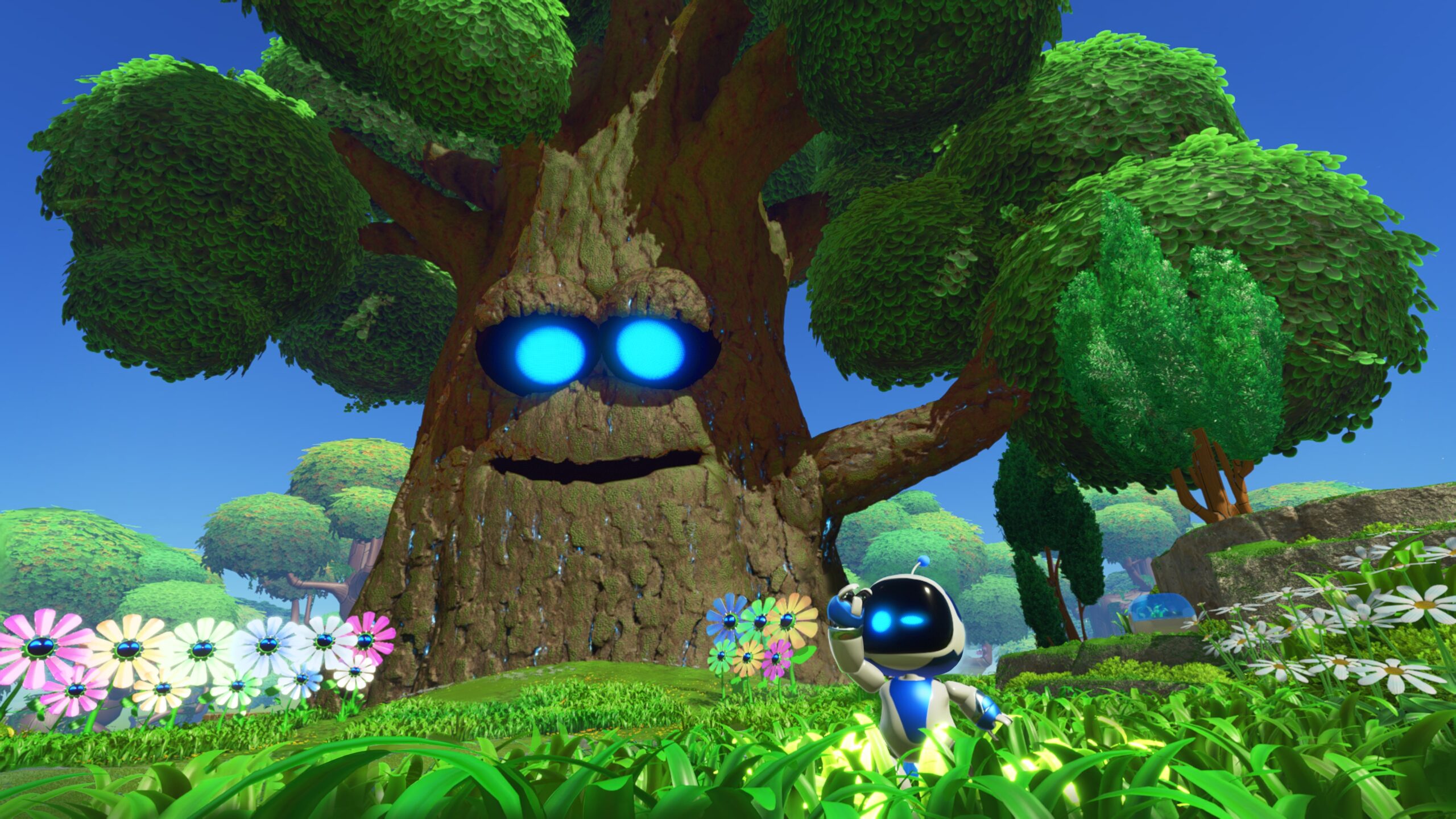 Astro Bot official PS5 screenshot showing Astro clearly near a giant tree and flowers